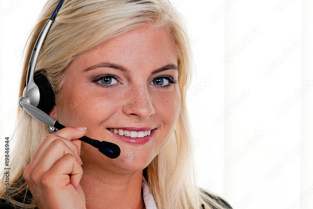 Woman with telephone headset in a call center Woman with telephone headset in a call center