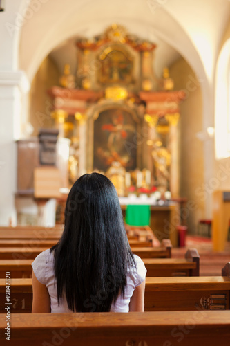 Women pray in a church
