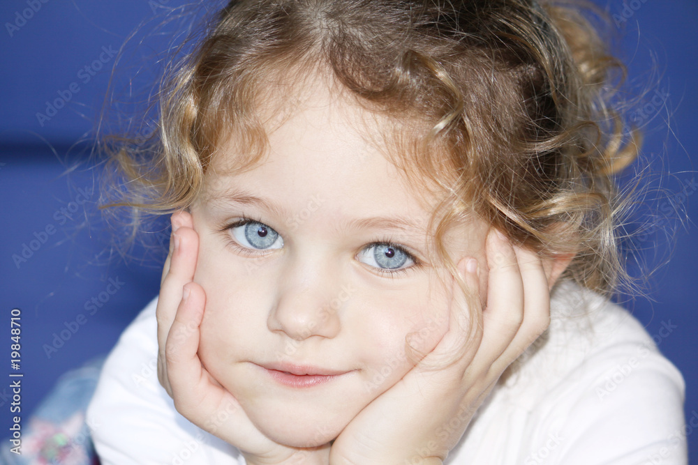 child with hands cupped on face child with hands cupped on face