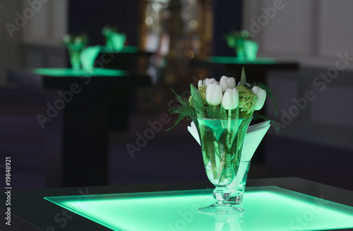 Hotel ballroom with luminous bar tables