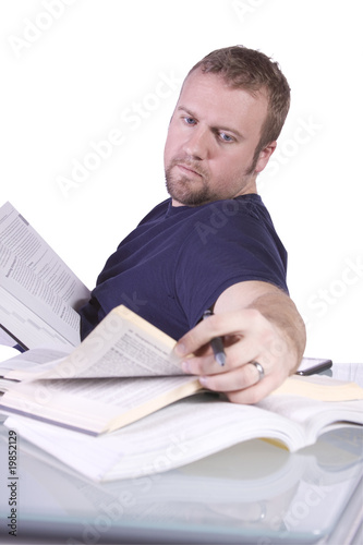 College Student with Books on the Table Studying