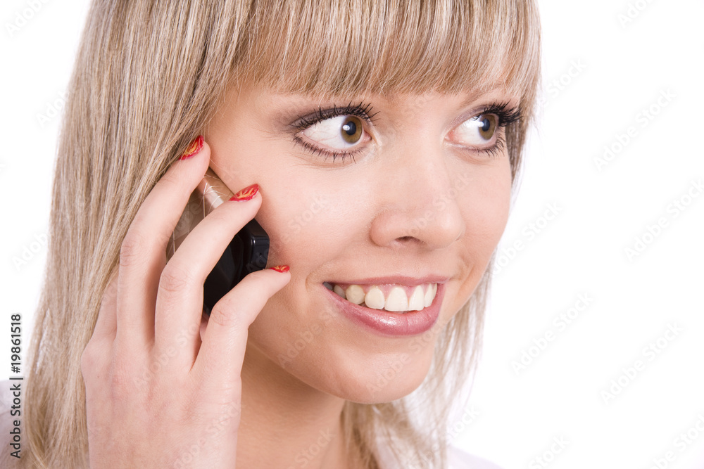 Smiling girl speaks on the mobile phone Smiling girl speaks on the mobile phone