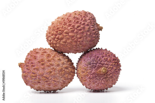 Three lychees in white background