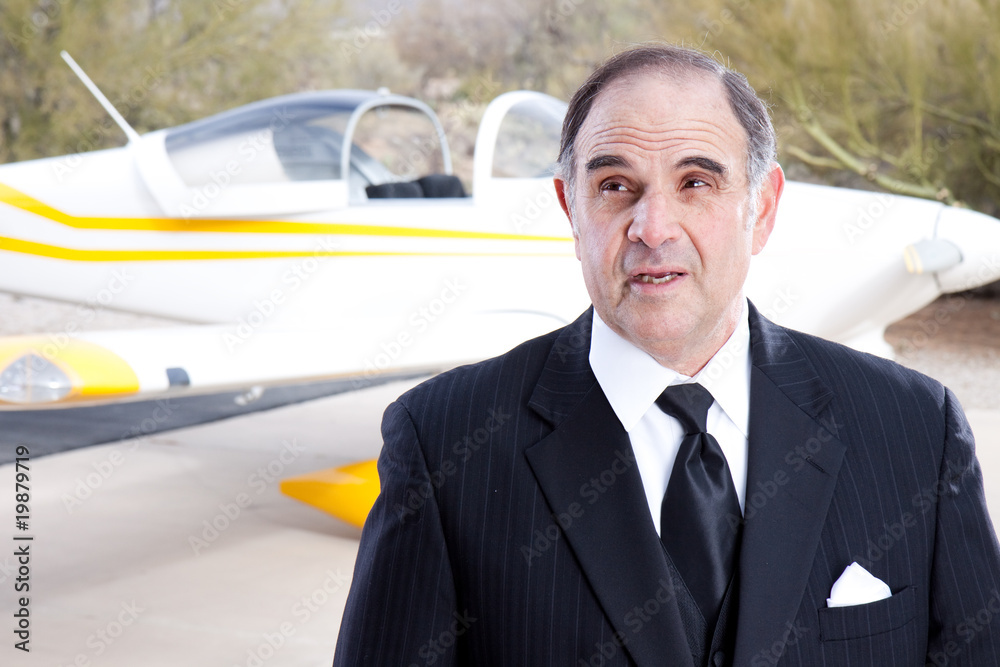 Wealthy industrialist with his private plane Wealthy industrialist with his private plane