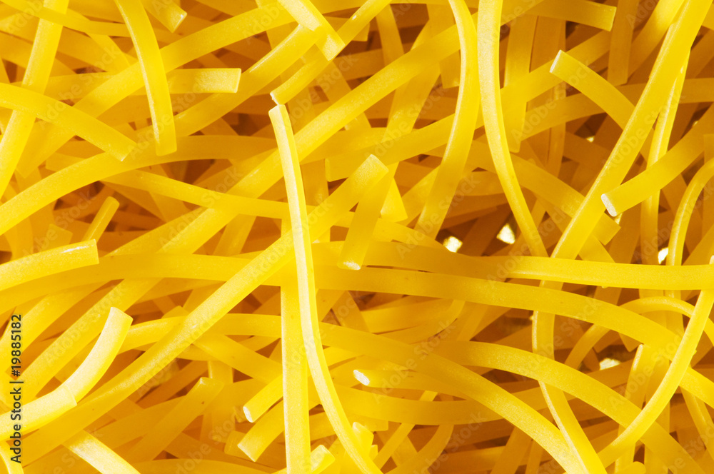 Extreme close up of yellow italian pasta Extreme close up of yellow italian pasta