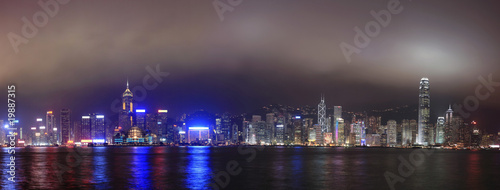 Panorama of the skyline of Hong Kong at night, with mist