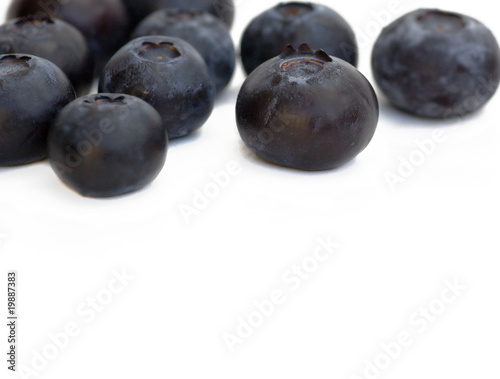 blueberries over white background with copy-space