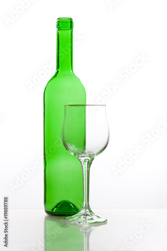 Transparent bottle of wine with glass
