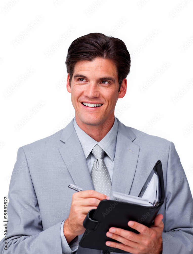 Attractive businessman holding an agenda Attractive businessman holding an agenda