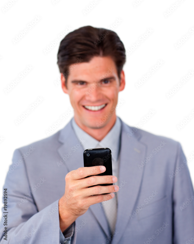 Smiling businessman using a mobile phone Smiling businessman using a mobile phone