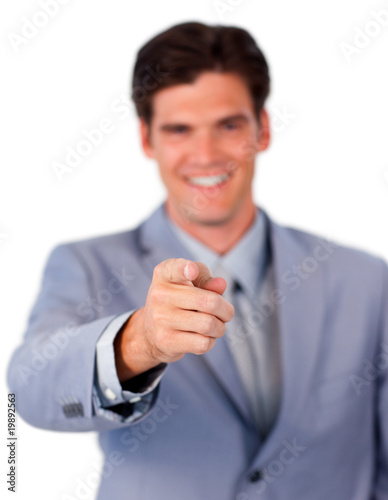 Positive businessman pointing at the camera