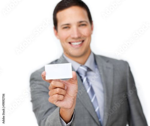 Smiling young businessman holding a white card