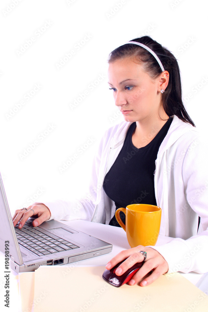 Teenager Drinking Coffee While Working on the Computer Teenager Drinking Coffee While Working on the Computer