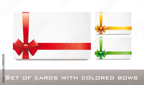 sat of blank white cards with colored bows and ribbons