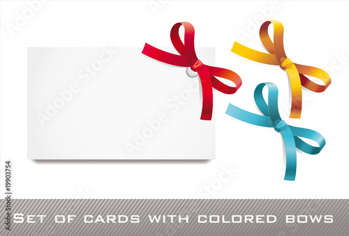 sat of blank white cards with colored bows and ribbons
