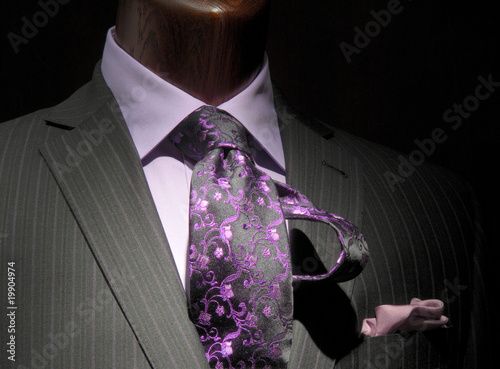 Striped jacket with purple shirt, patterned tie and handkerchief