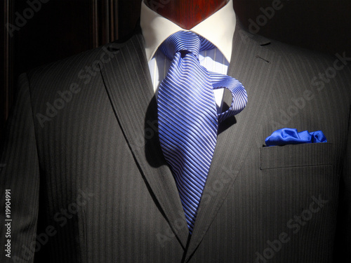 Striped jacket with blue striped tie and handkerchief