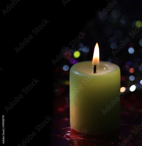light candle on dark background