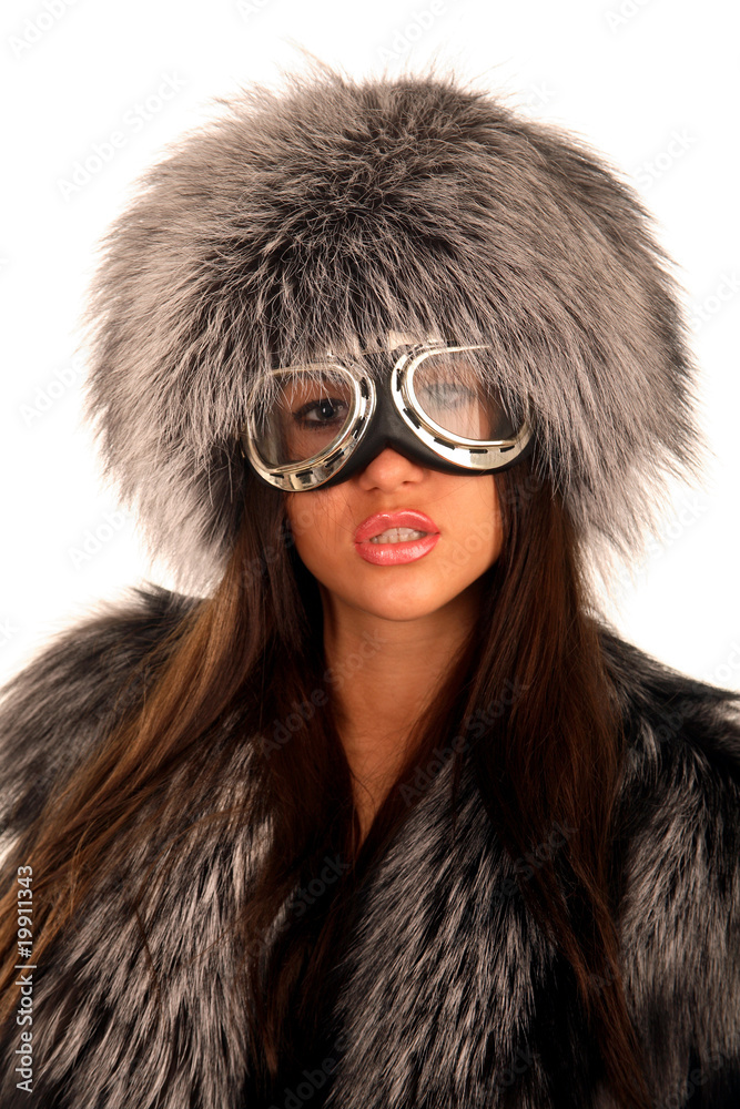 Portrait of young elegant girl with fur coat and big glasses Portrait of young elegant girl with fur coat and big glasses