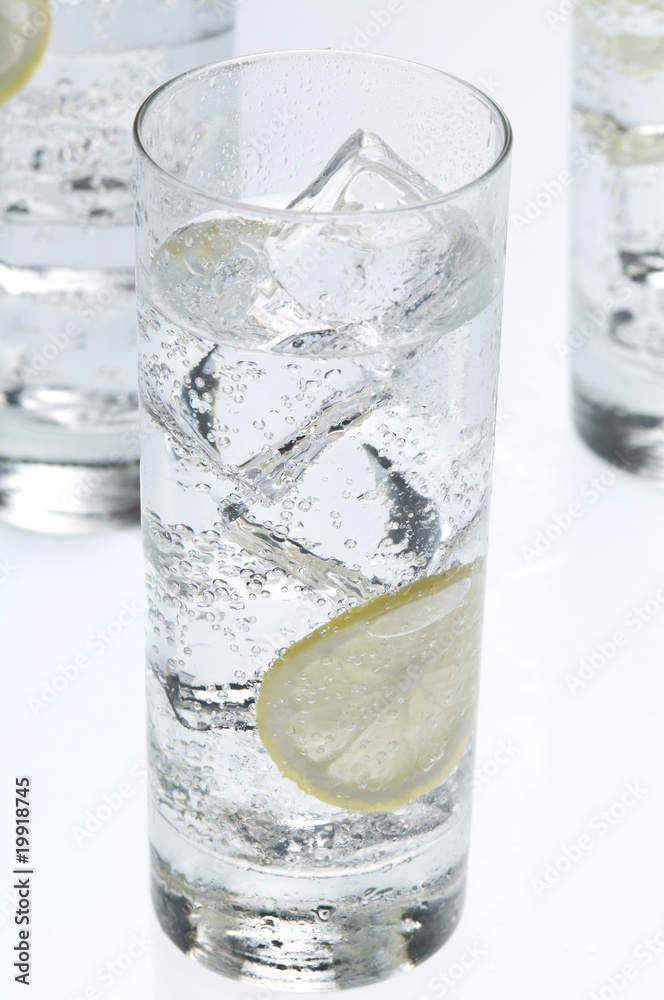 Glasses objects with soda water and ice cubes Glasses objects with soda water and ice cubes