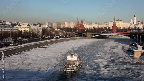Kremlin and Dormition Cathedral with boat on river