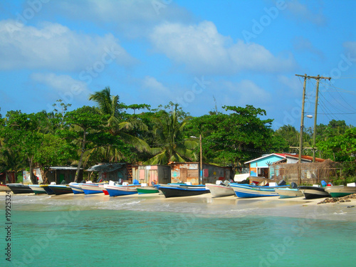 Canvas Print panga fishing boats with houses corn island nicaragua