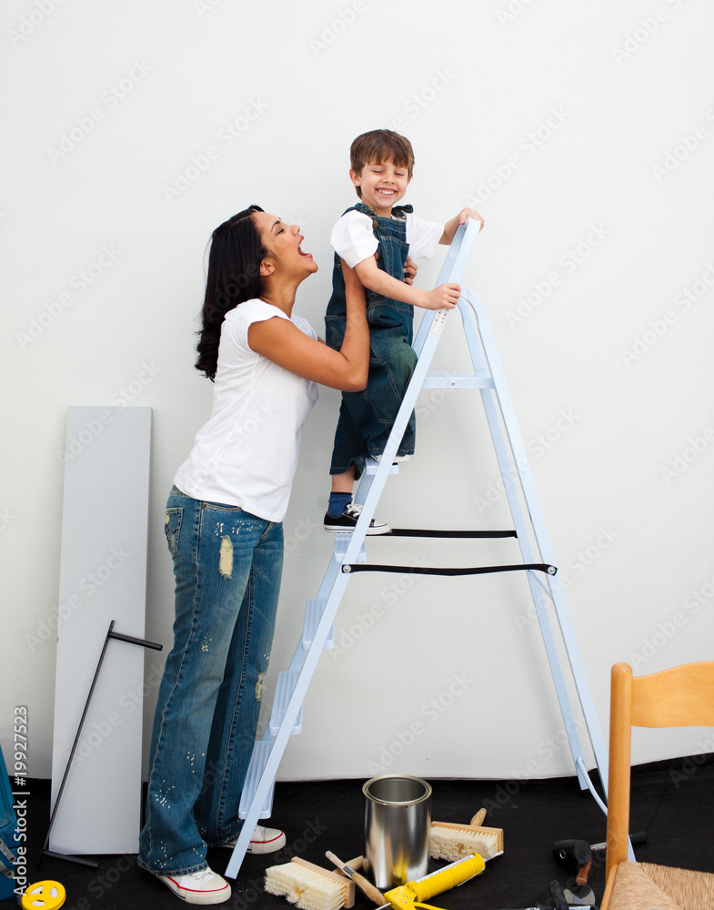 Adorable little boy climbing a ladder
