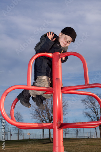 Fototapeta Naklejka Na Ścianę i Meble -  Little Boys having fun on an outdoor playground