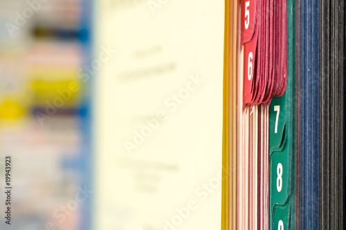 Close-up of book with colored tabs