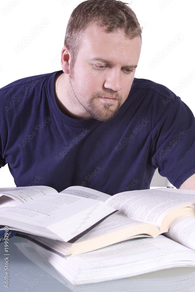 College Student with Books on the Table Studying College Student with Books on the Table Studying