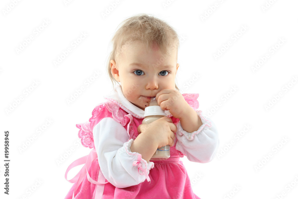 Pretty baby girl is drinking milk in a bottle isolated Pretty baby girl is drinking milk in a bottle isolated
