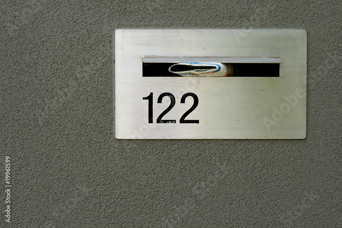 Foto silver metallic letterbox for home in grey wall