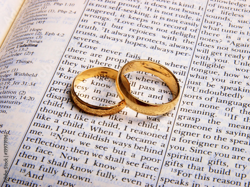 Wedding rings on a bible. Close up