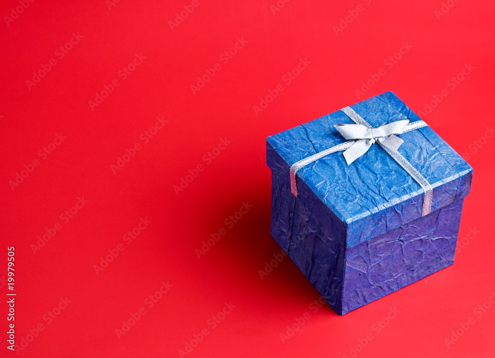 Blue gift on a red background Blue gift on a red background