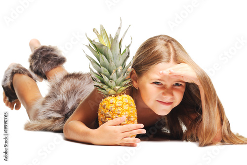 little girl dressed as prehistoric man taking pineapple