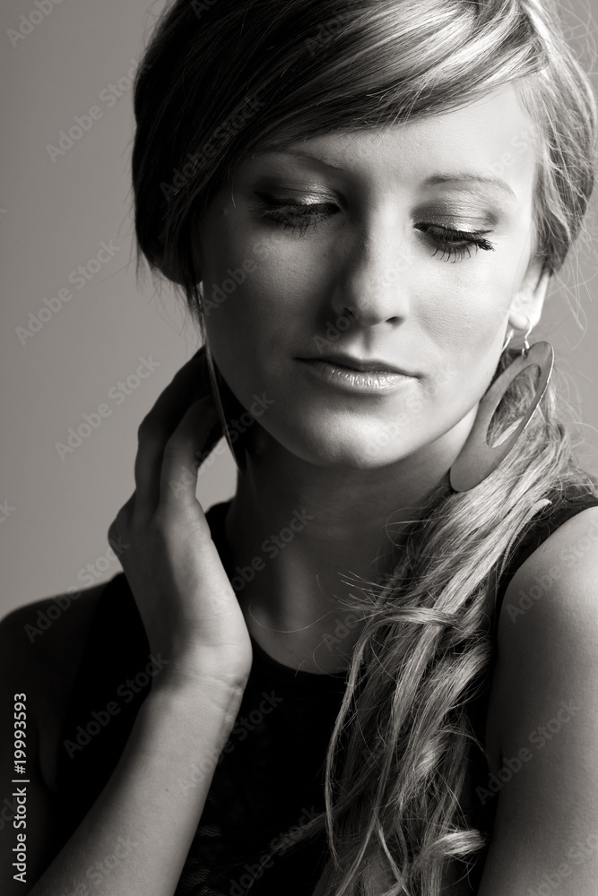 Studio Shot of a Pretty Teenage Girl against Grey Background Studio Shot of a Pretty Teenage Girl against Grey Background