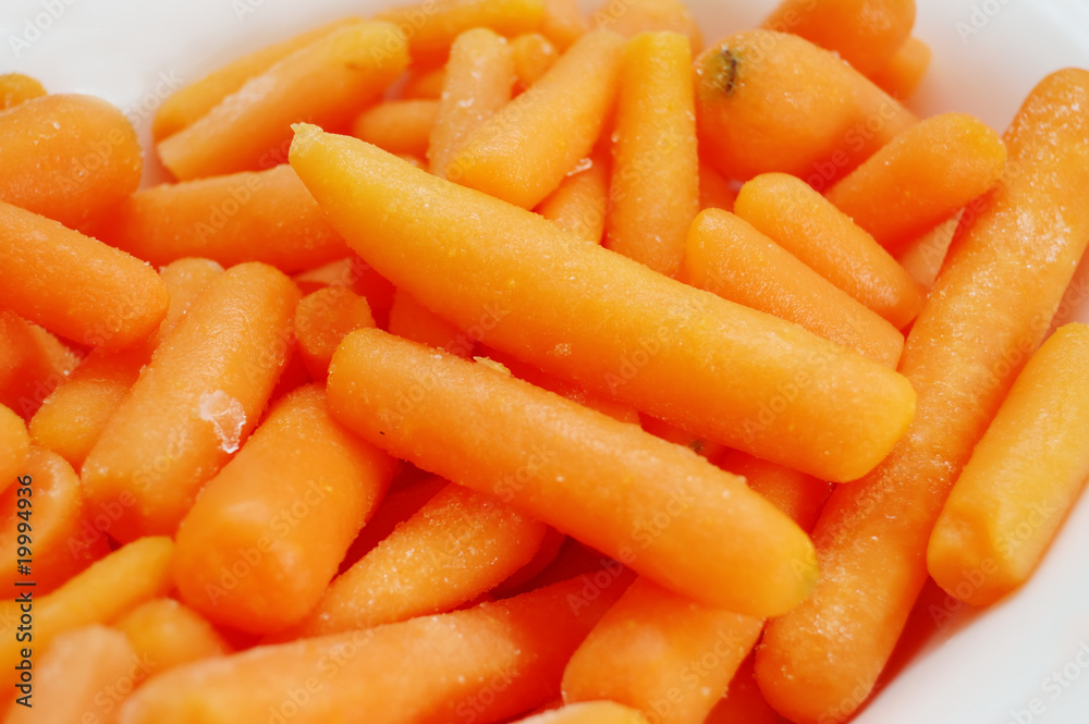 Close up of frozen baby carrots