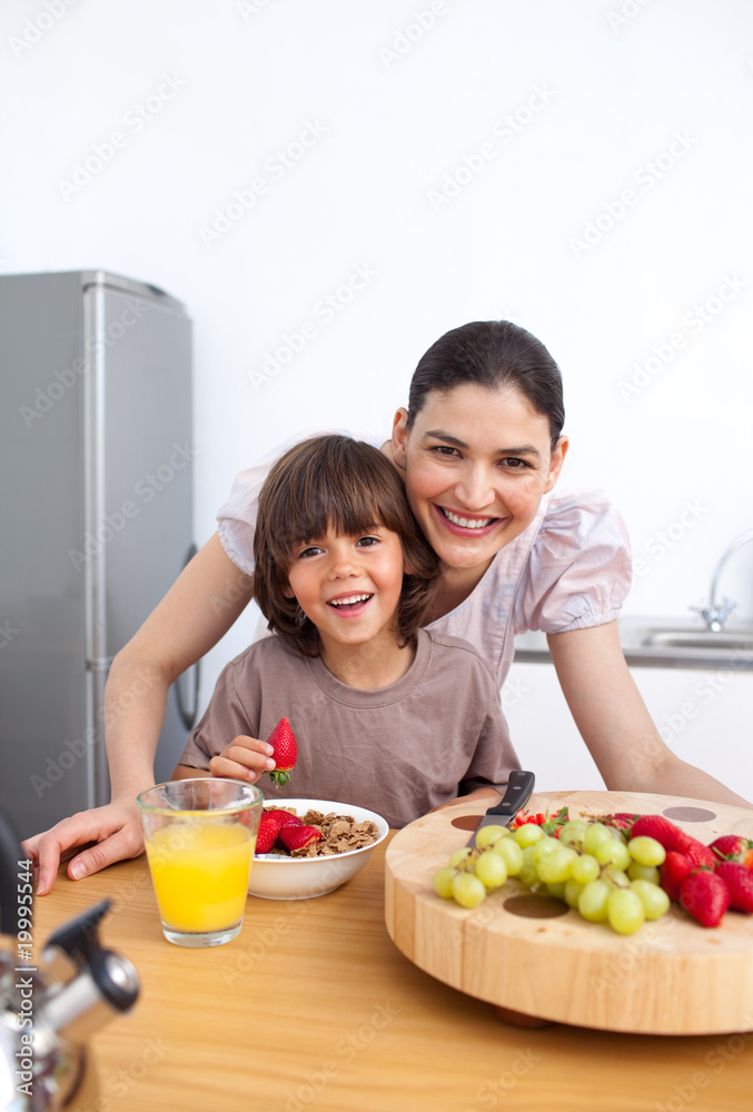 Mother and her child having breakfast