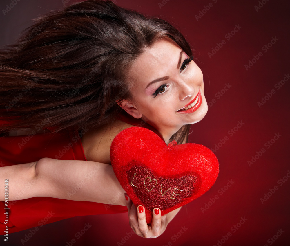 Girl with heart on red background flying. Valentine's Day Girl with heart on red background flying. Valentine's Day