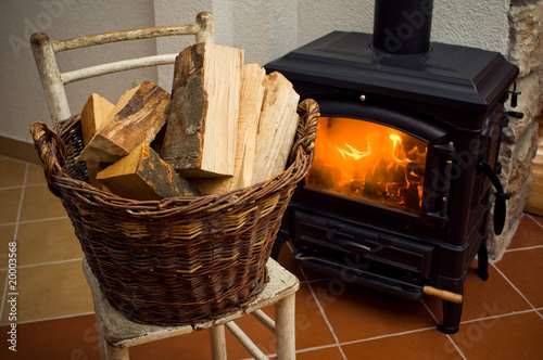 Logs in front of a stove photo