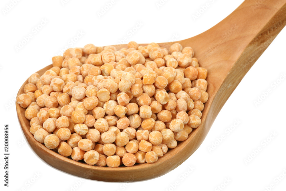 Dry peas in a wooden spoon on a white background Dry peas in a wooden spoon on a white background