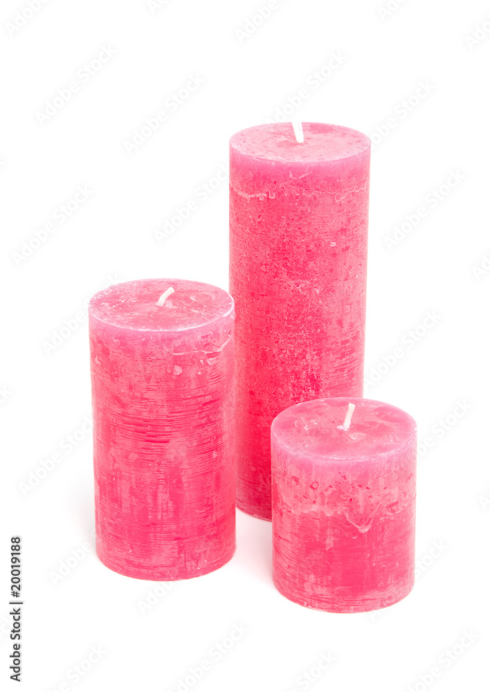 Pink candles over white background Pink candles over white background
