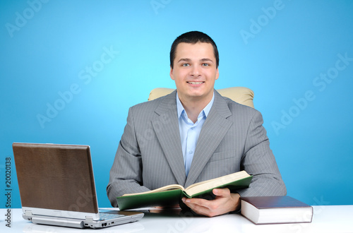 Cheerful businessman on blue background