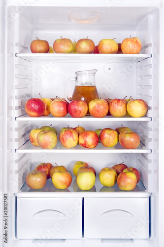 apples with jug in the refrigerator