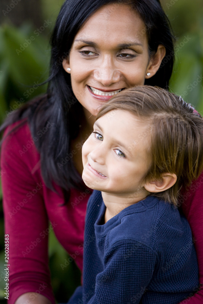 Closeup of loving mother with cute mixed-race 5 year old son Closeup of loving mother with cute mixed-race 5 year old son