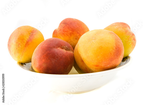 peaches on plate isolated