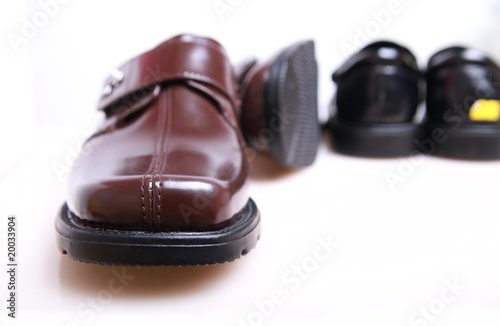 Luxury Shiny Brown Leather Dress Shoes on White Background

