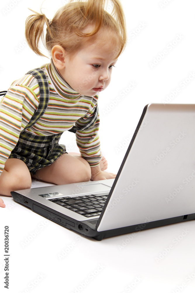 Baby girl with laptop isolated on white Baby girl with laptop isolated on white