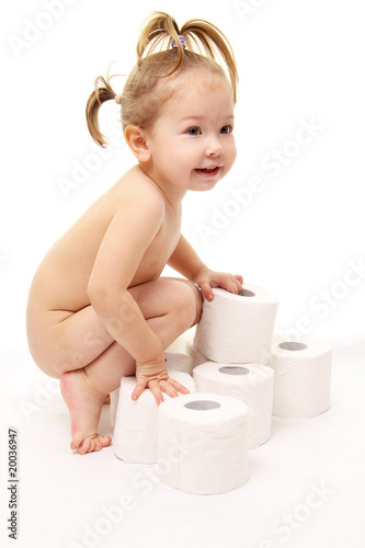 Baby girl with toilet paper