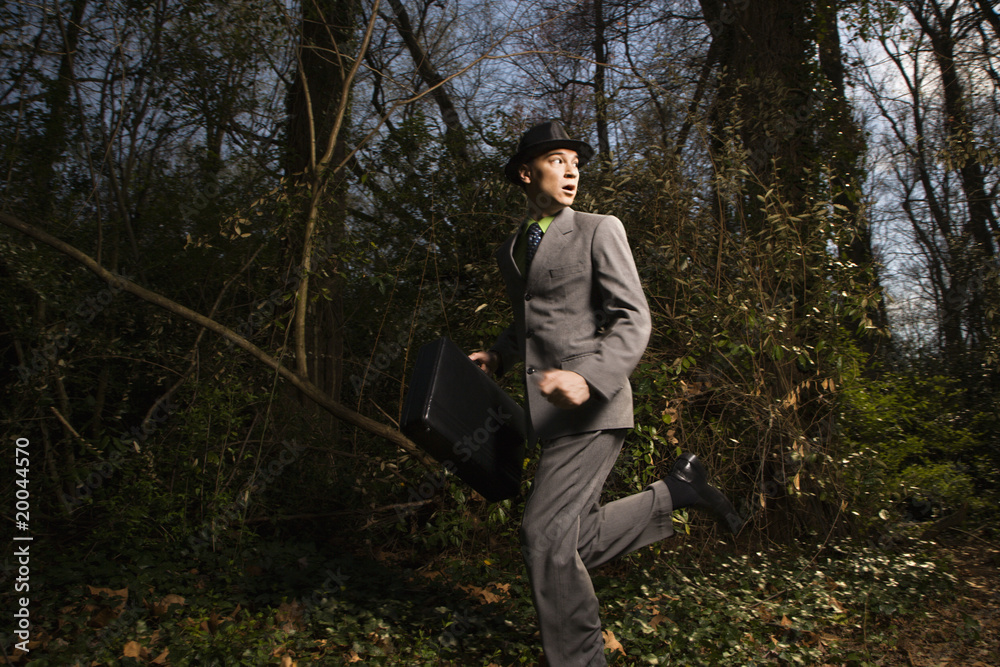 Young Businessman Running In Woods Young Businessman Running In Woods
